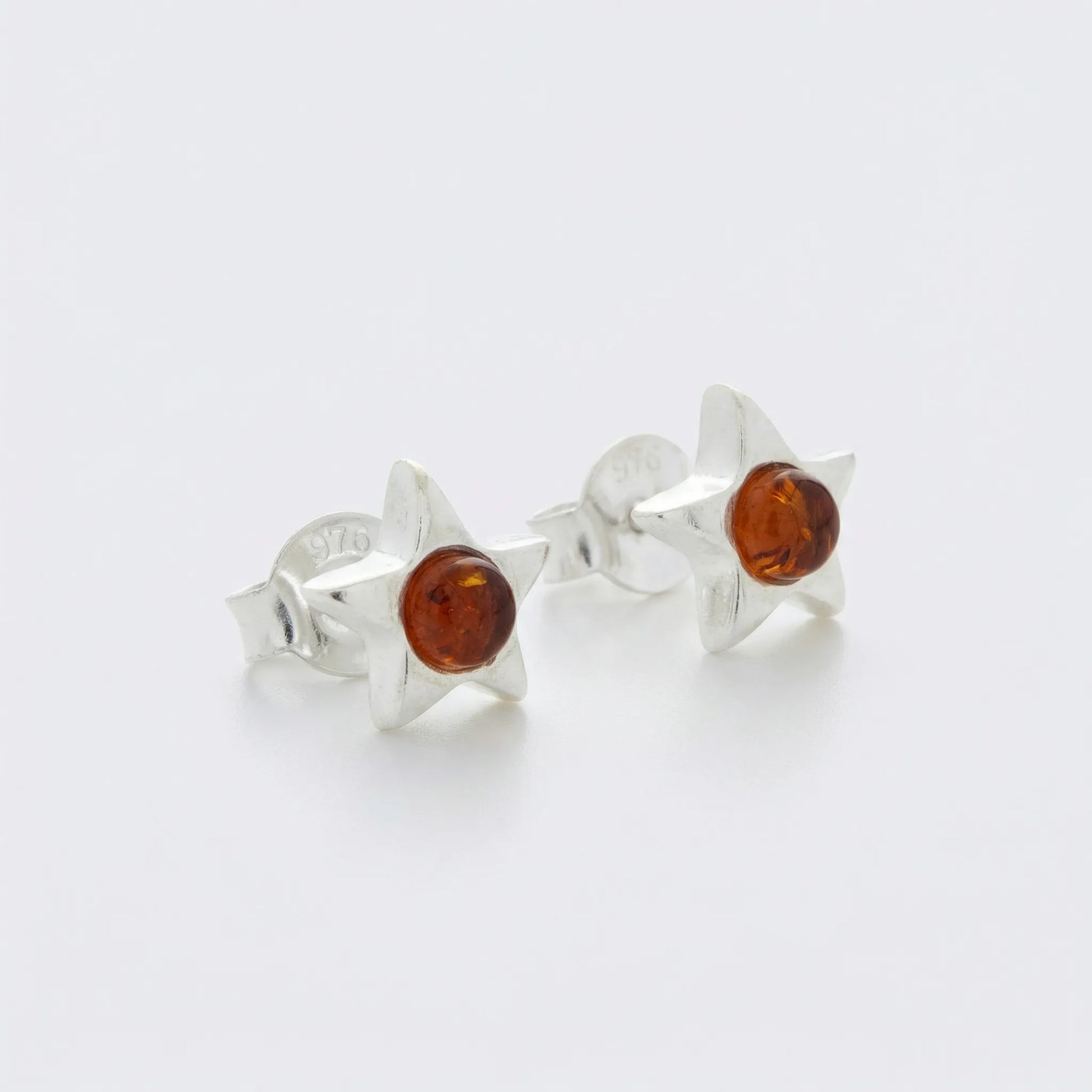 Boucles d'oreilles étoile ambre cognac puces argent rhodié