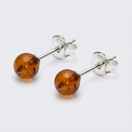 Clous d'oreilles ambre cognac de la mer Baltique boule en argent rhodié 925